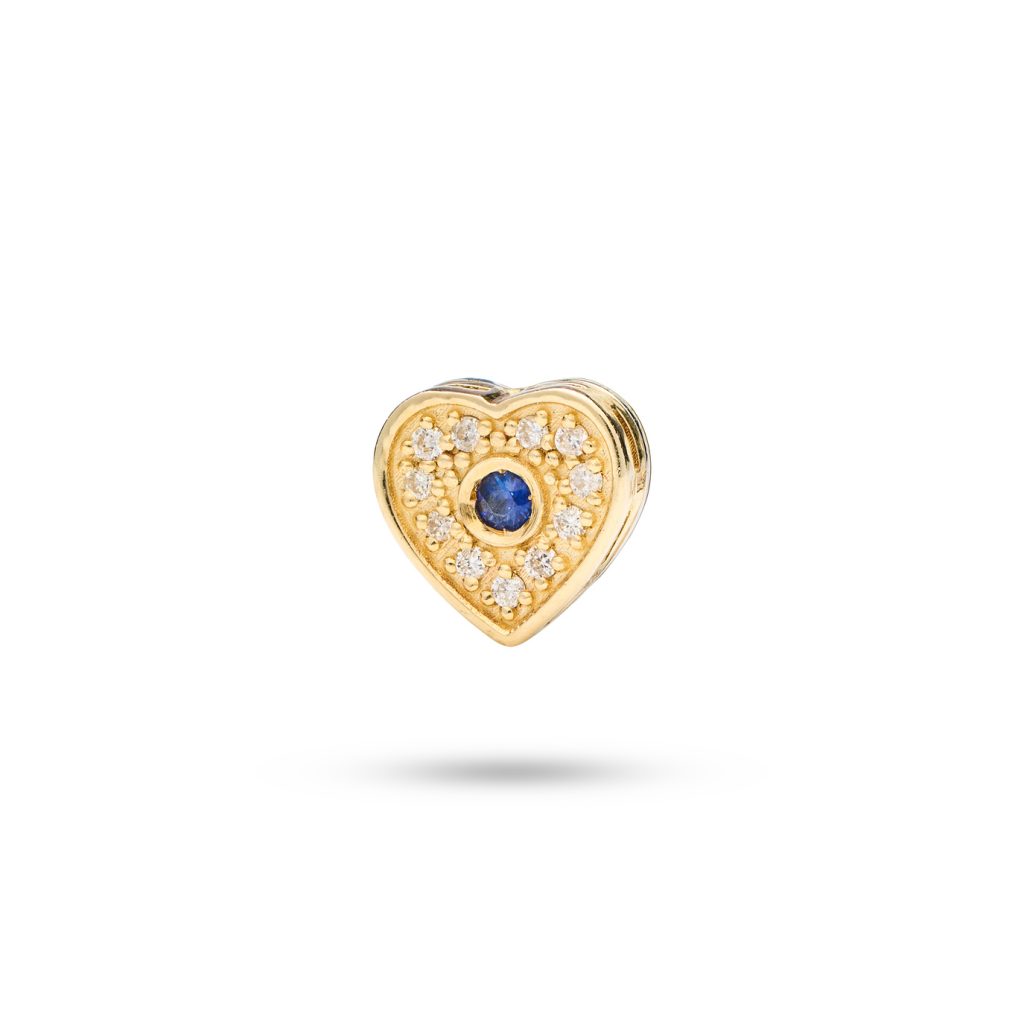 Heart-shaped dog charm in 14k gold with a blue sapphire and 11 diamonds, symbolizing eternal love and devotion.