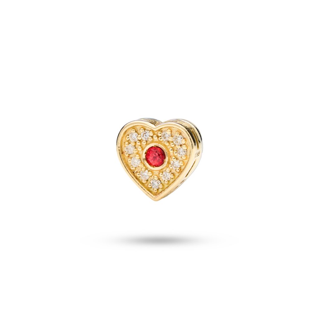 Heart-shaped dog charm in 14k gold with an orange sapphire and 11 diamonds, symbolizing everlasting love and loyalty.