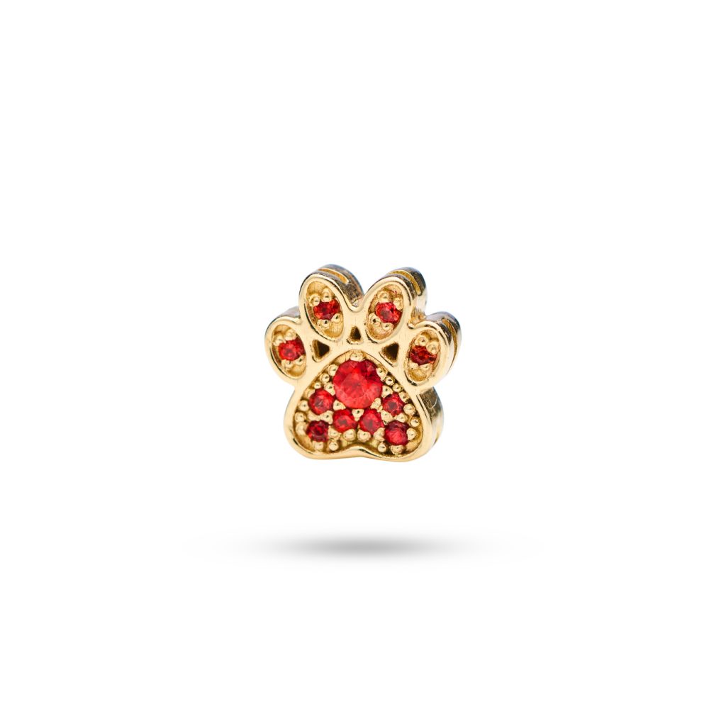 14k gold paw print charm with 11 orange sapphires, symbolizing the special bond and joyful moments shared with your dog