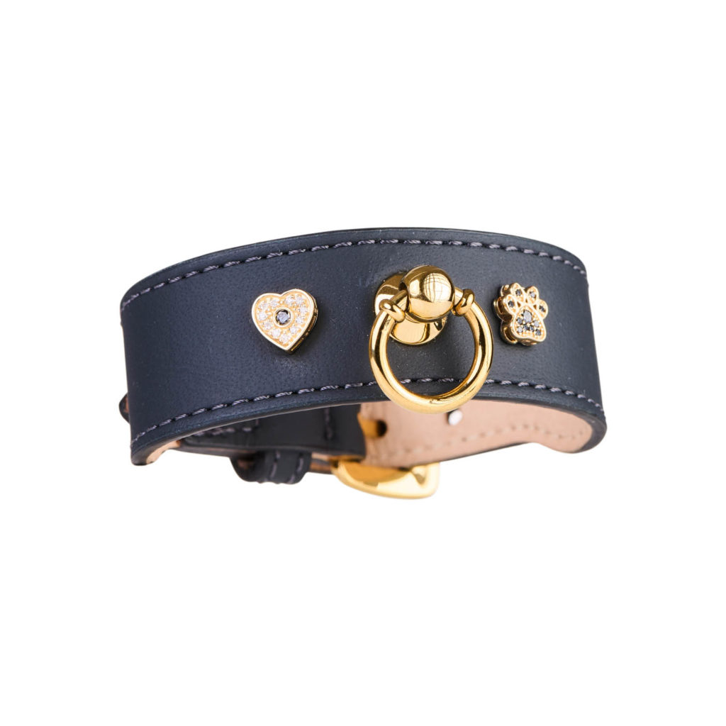mage of MAYADORO Light Black Leather Bracelet with Two Charms: Paw and Heart in 14k Gold with Black and White Diamonds.
