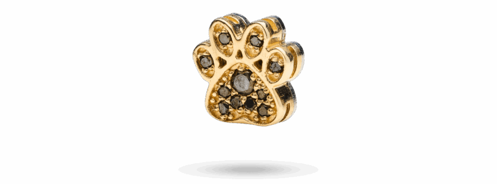 Paw motif in 14k gold set with pavé black diamonds