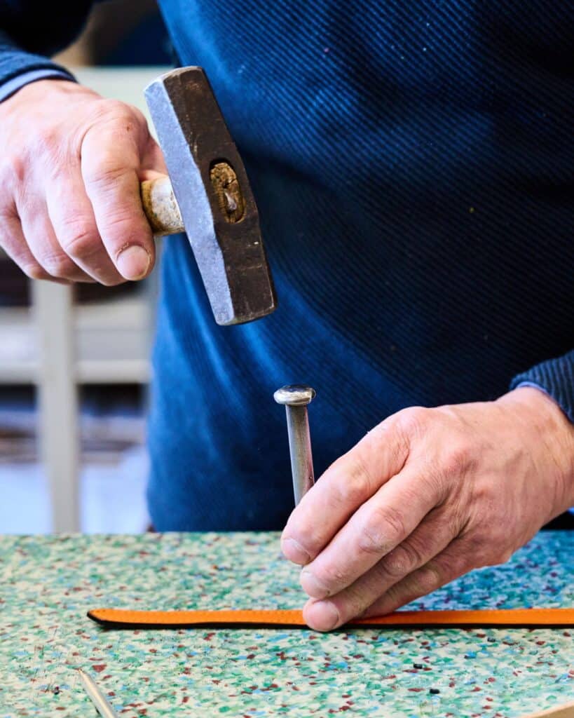 Handcrafting a leather dog collar in an Italian atelier